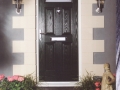 A secure and realiable black composite front door - Double Glazing as standard helping to save you energy